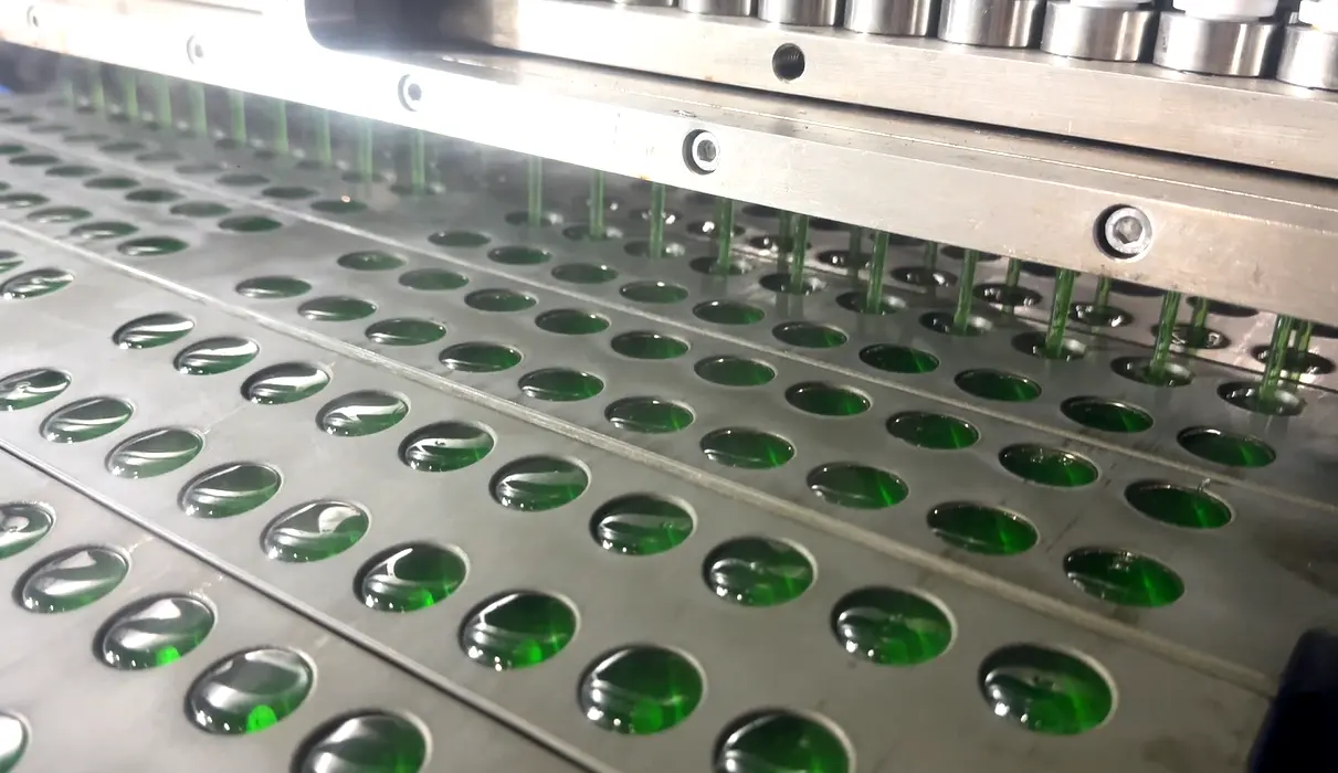 Automated gummy production line with depositing, drying, and quality control systems