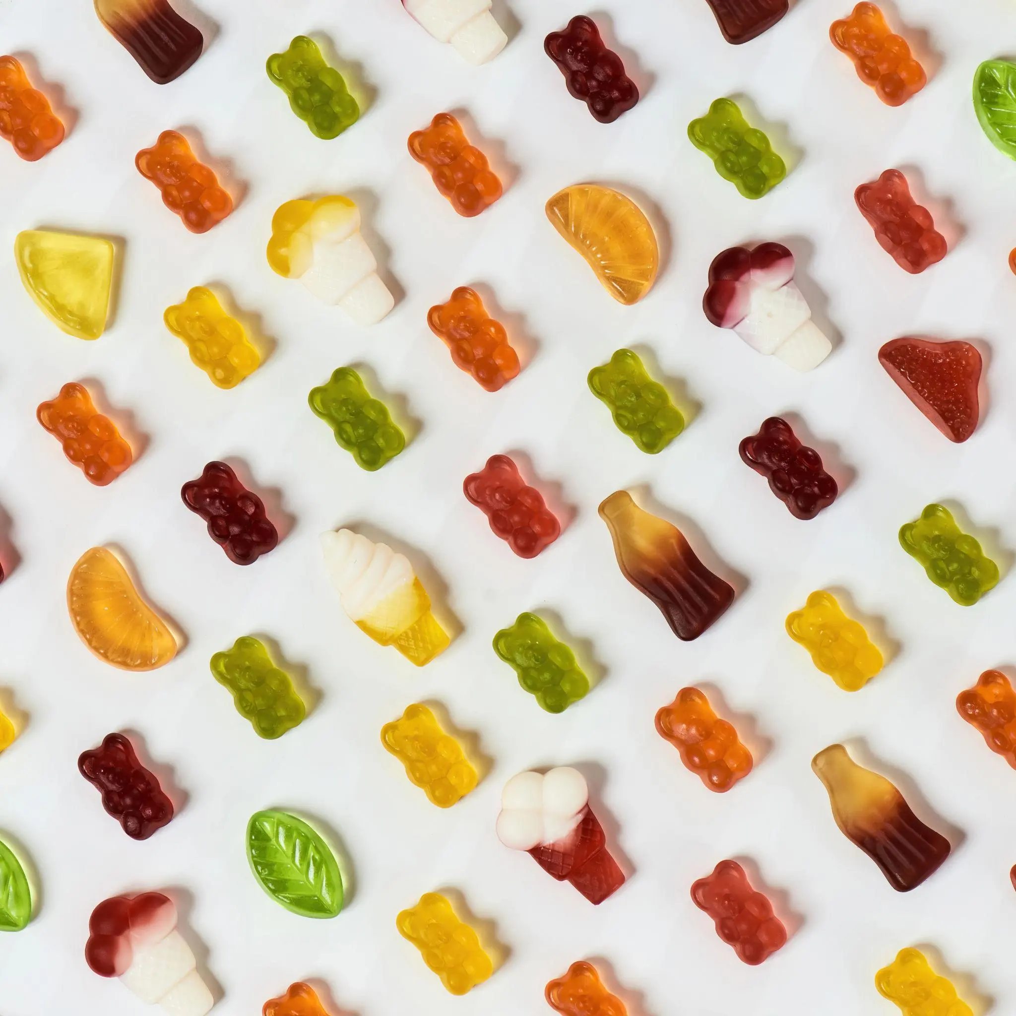 Custom gummy shapes and piece weight options including bear gummies, heart gummies, drops, buttons, fruit shapes and 0.5g to 20g gummy pieces